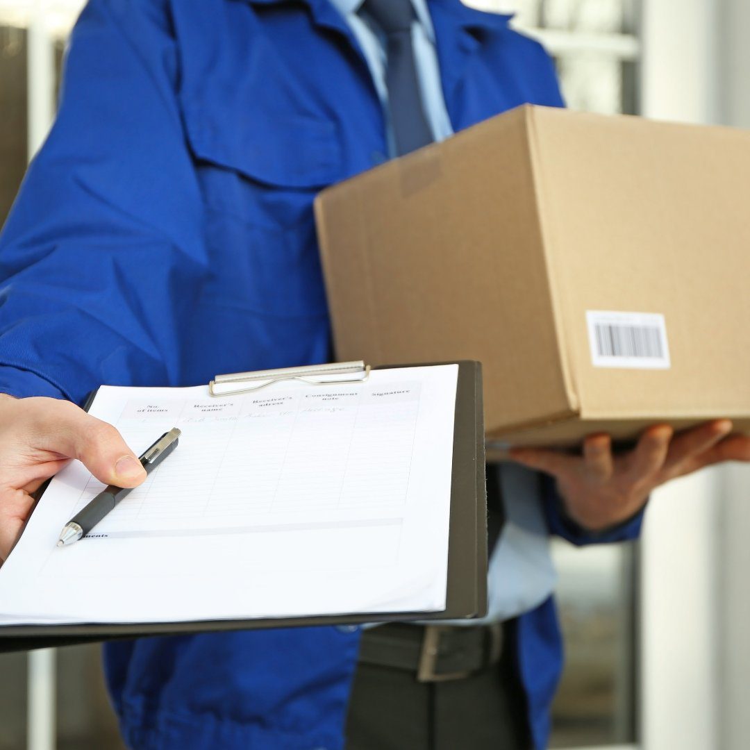 Courier with parcel and clipboard on doorstep, closeup Courier with parcel and clipboard